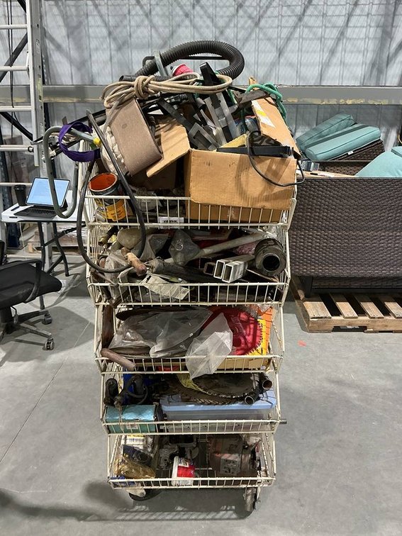 Tower Rack Containing Starters, Pulleys, Welding Helmet, Hoses, Filters, Nuts and Bolts, Tools, and lots more