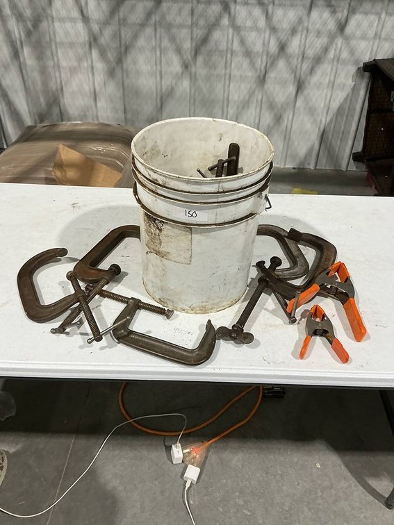 9- C-Clamps, Vise Grips, Hammer, 2- Clamps in a 5 gallon bucket