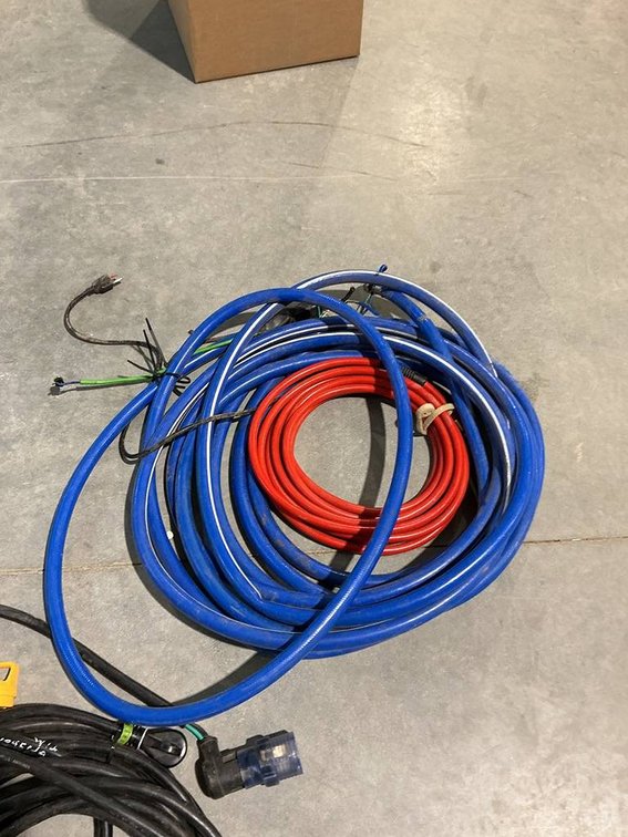 Lot Containing Camper Plug Adapters, Jumper Cables, Garden Hoses, and Air Hoses