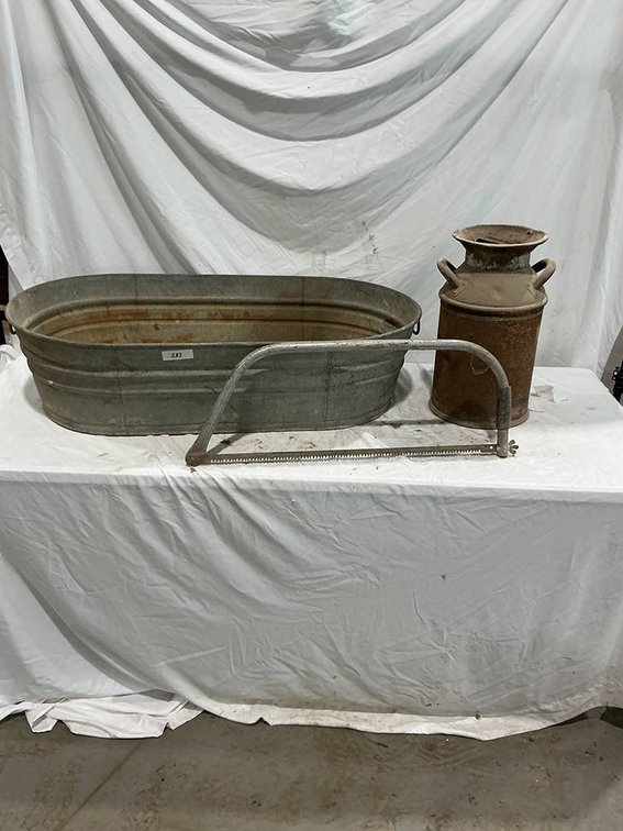 42"x23"x11" Water Trough, 5 Gallon Milk Can, and a 30" Hand Saw