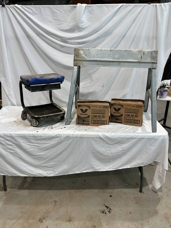 12- 1qt Bottles of Valvoline 5W30 Sae Motor Oil, Napa Rolling Work Seat, and 1- Sawhorse
