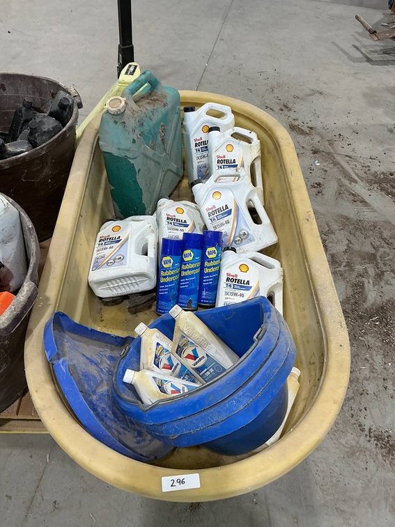 Large Water Trough Containing Feeder Buckets, 6- One Gallon Jugs of Shell Rotella 15w-40 Motor Oil, 6- One Quart Bottles of Valvoline 5w-30 Motor Oil, a Jerry Can and More
