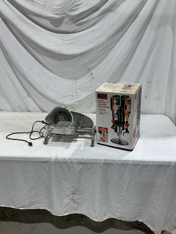 Oggi 4 Bottle Revolving Liquor Dispenser, and a Rival Electric Food Slicer