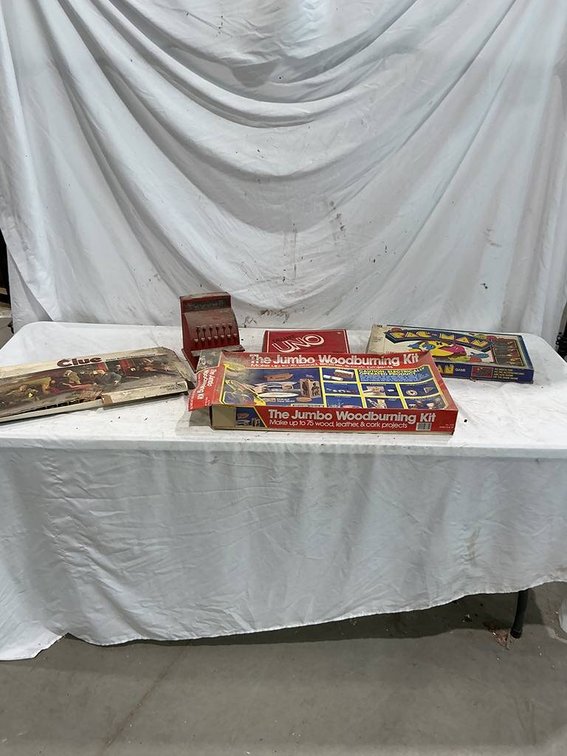 Vintage Board Games including, PAC-MAN, Clue, Uno, and a Vintage Cash Register Toy, along with a Jumbo Woodburning Kit