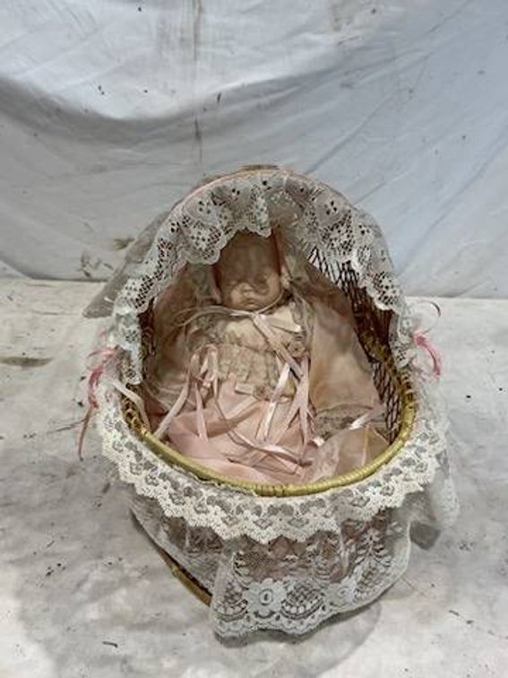 Vintage Porcelain Baby Doll in a Lace-Adorned Wicker Cradle Bassinet