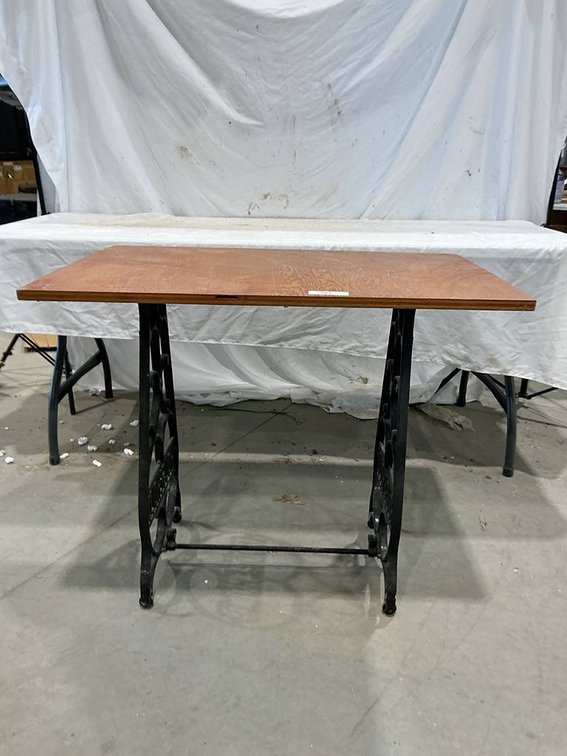Homemade Table With a Wooden Top and Iron Sewing Machine Frame