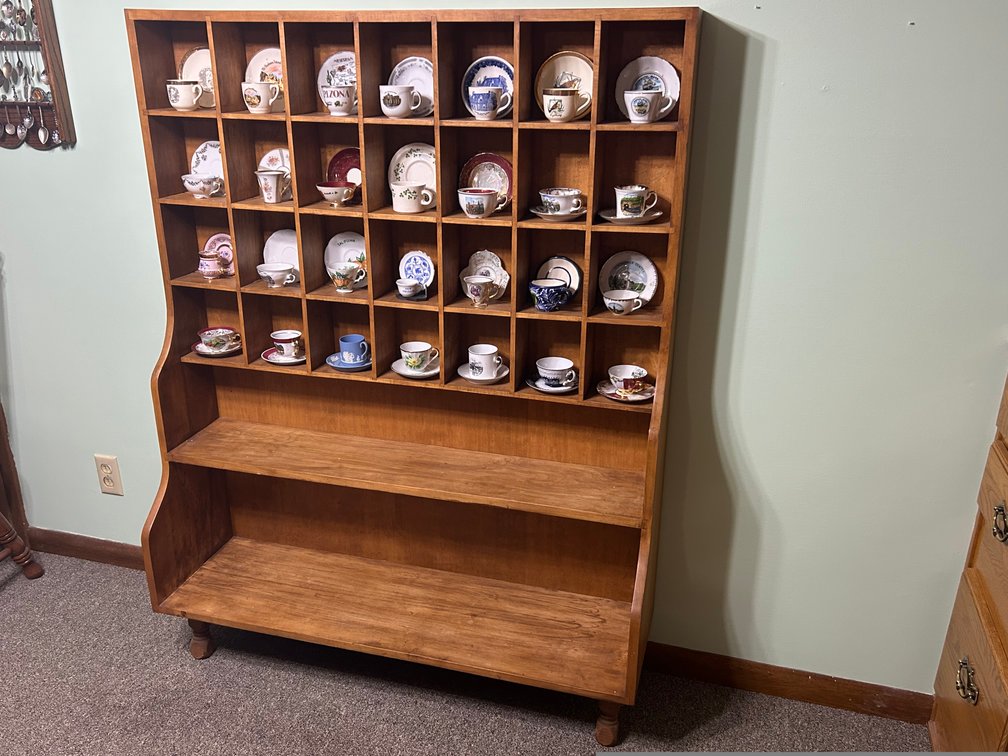 Cups and Saucers in a Wooden Display Case