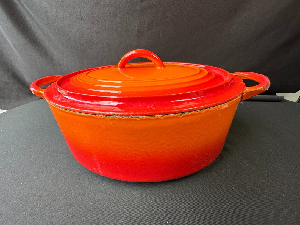 Orange Enameled Cast Iron Oval Dutch Oven with Lid
