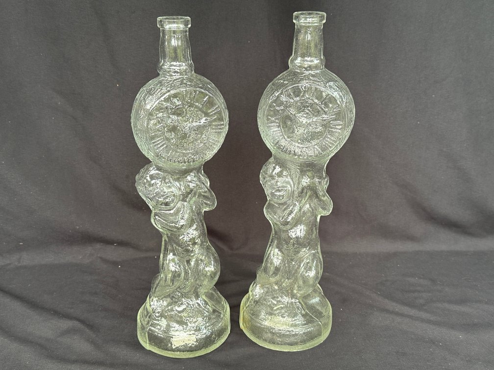 Pair of Molded Clear Glass Cherub Clock Bottles