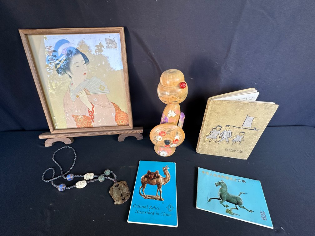 Framed Japanese Print, Kokeshi Doll, Necklace, and Books