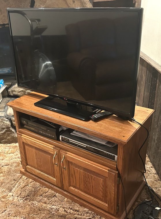 LG TV with VCR, DVD Player, and Oak Cabinet