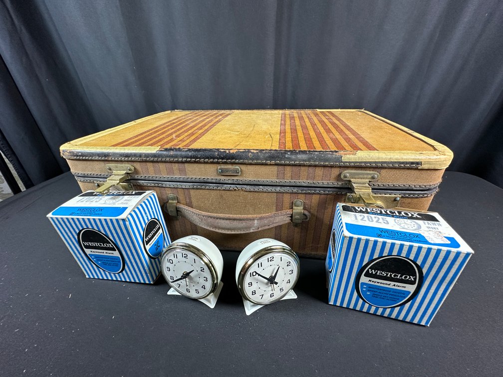 Striped Canvas Suitcase and Keywound Alarm Clocks