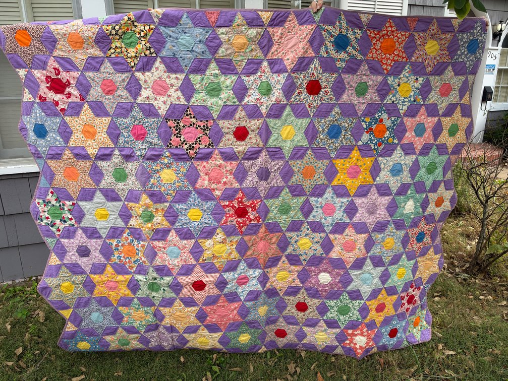 Patchwork Star Quilt with Purple Sashing