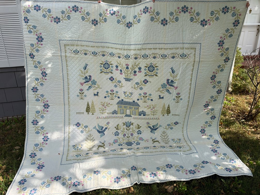 Cross-Stitch Sampler Quilt with House and Floral Motifs