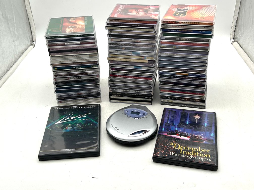 Variety of CDs and Portable CD Player
