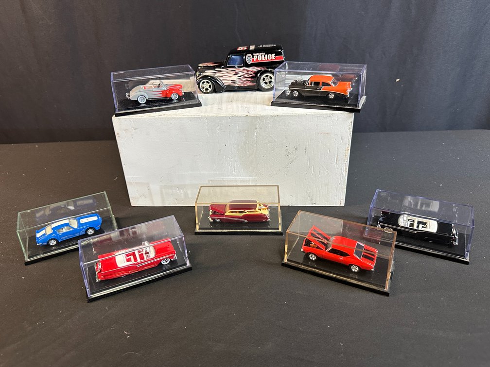 Eight Die-Cast Model Cars with Display Cases