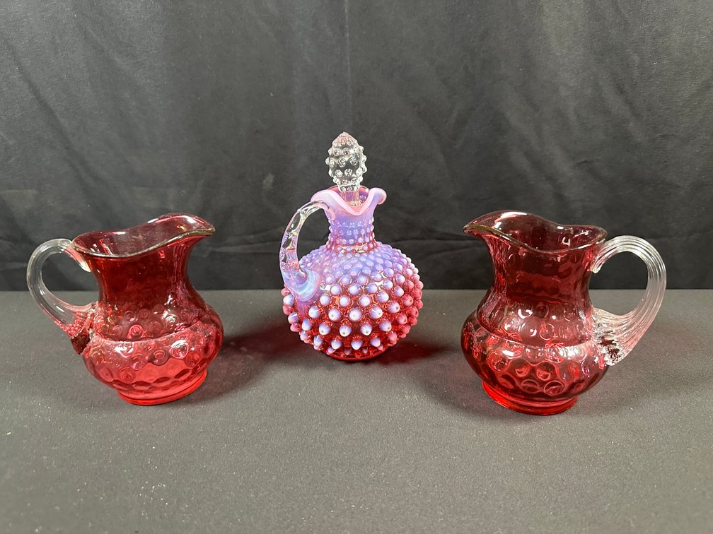 Cranberry Glass Cruet and Inverted Thumbprint Creamers