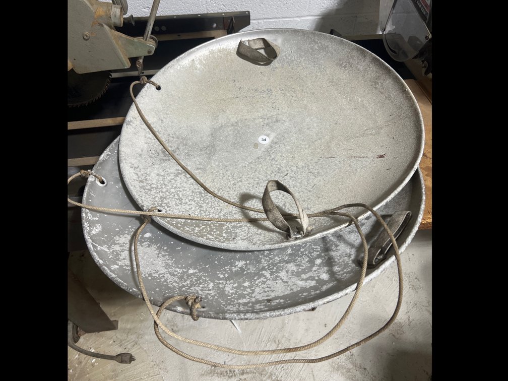 Pair of Old Round Aluminum Sleds