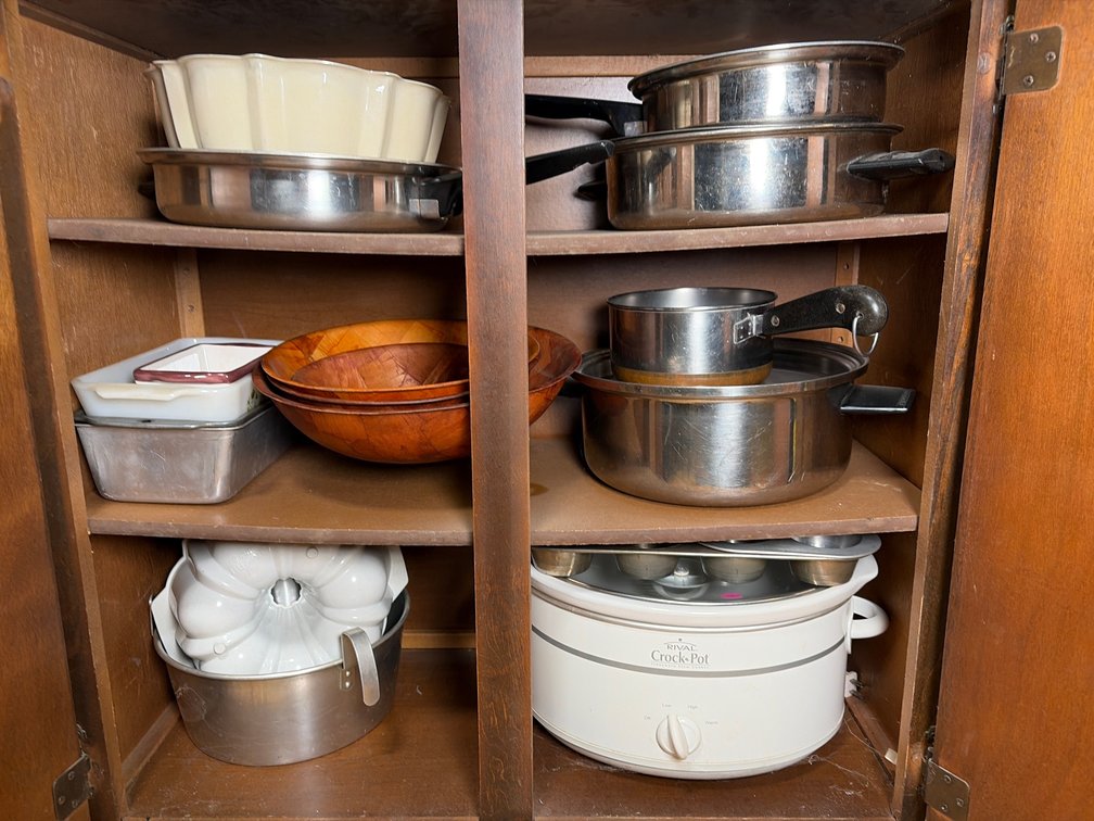 Pots, Pans, Crockpot, and Wooden Cabinet