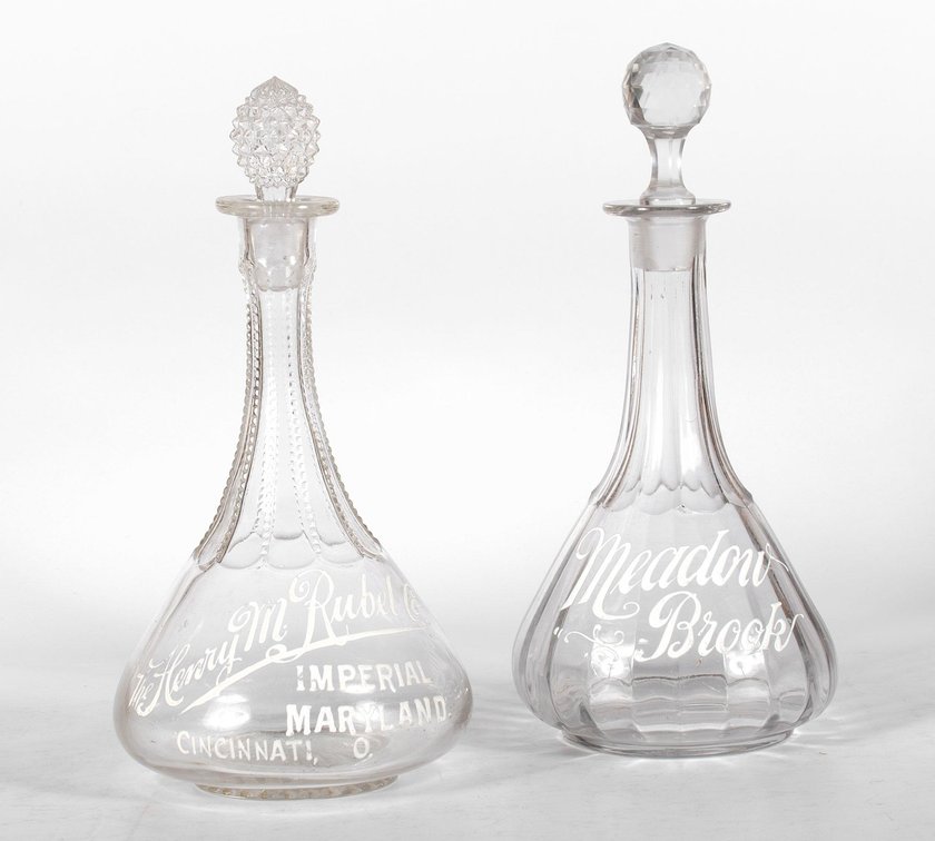Two Enameled Saloon Back Bar Bottles