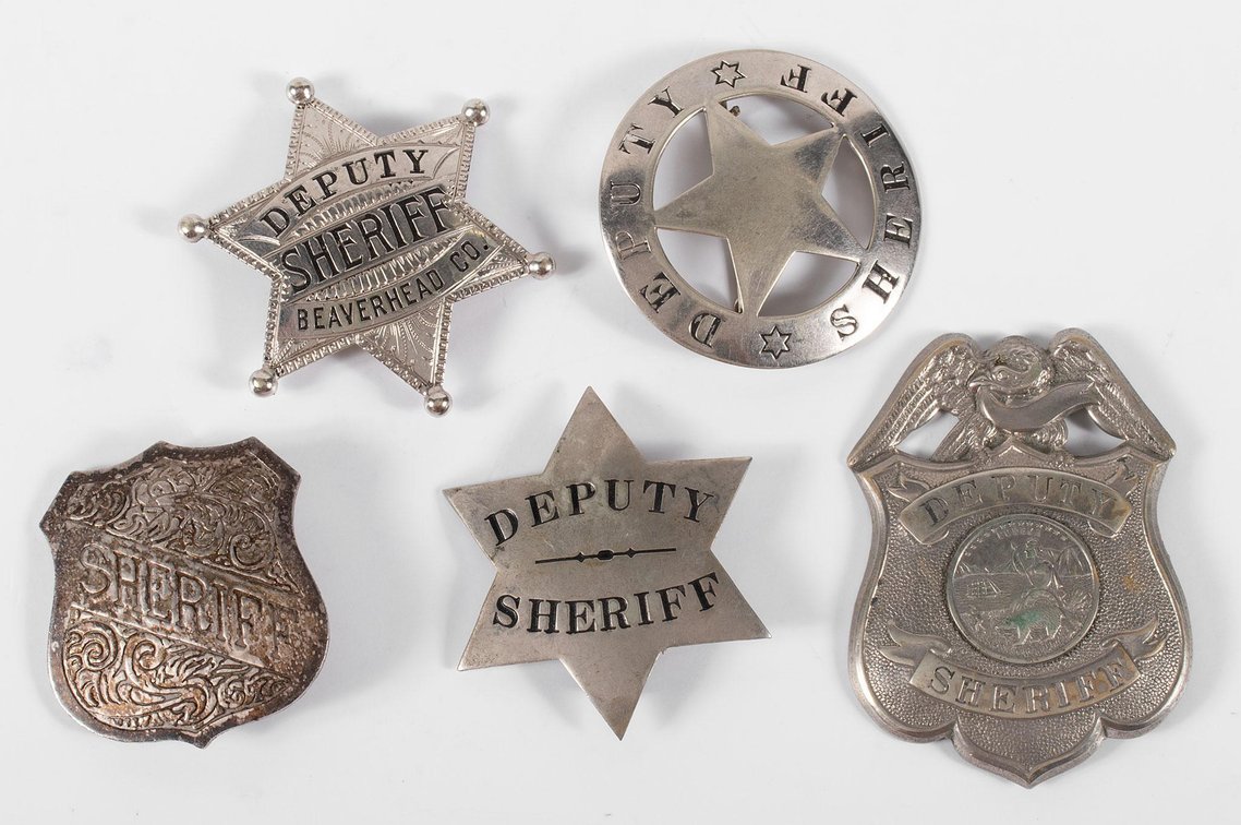 Grouping of Obsolete Deputy Sheriff and Sheriff Badges