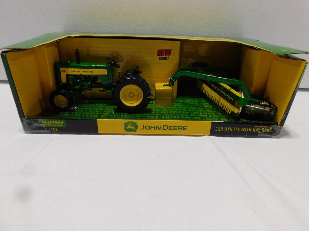 John Deere 330 w/ Rake