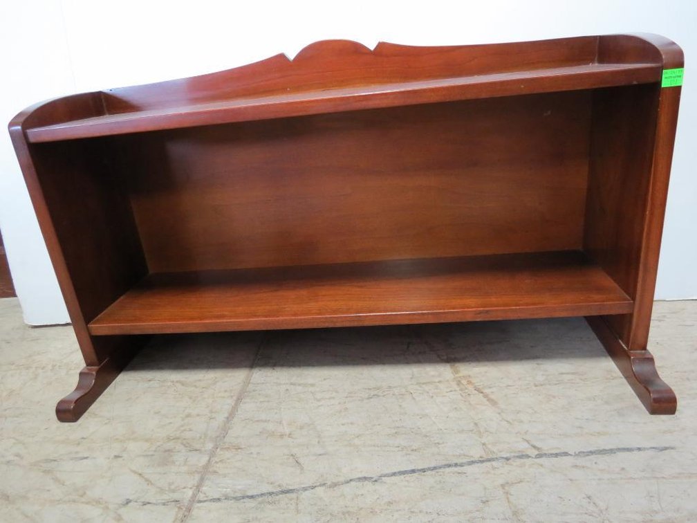 A vintage desk top wood shelf.