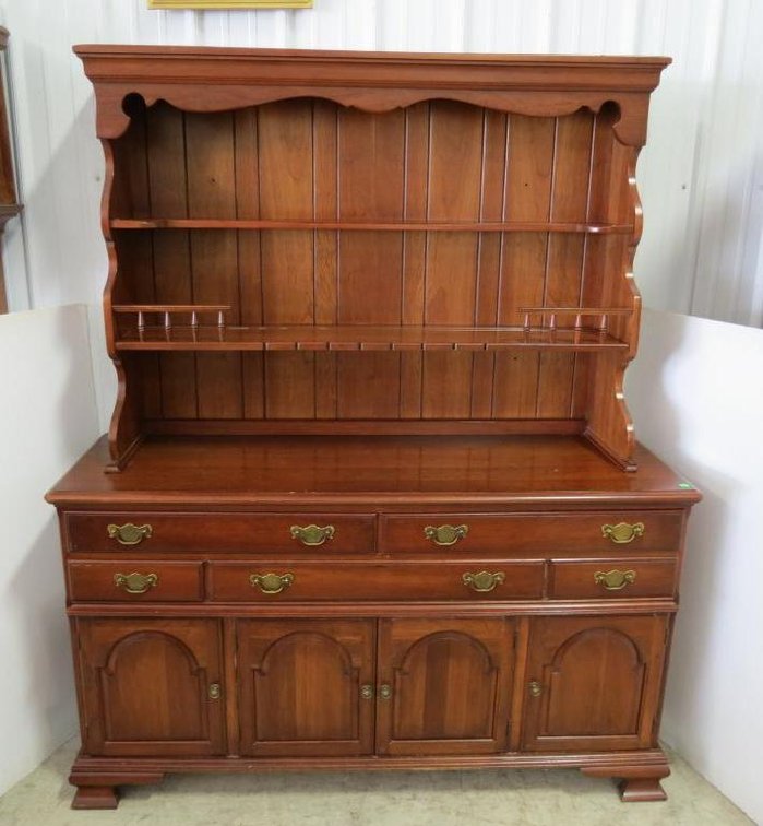 A cherry Pennsylvania House pewter hutch with four doors.