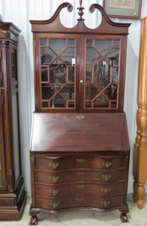 A mahogany serpentine front / drop front china secretary.