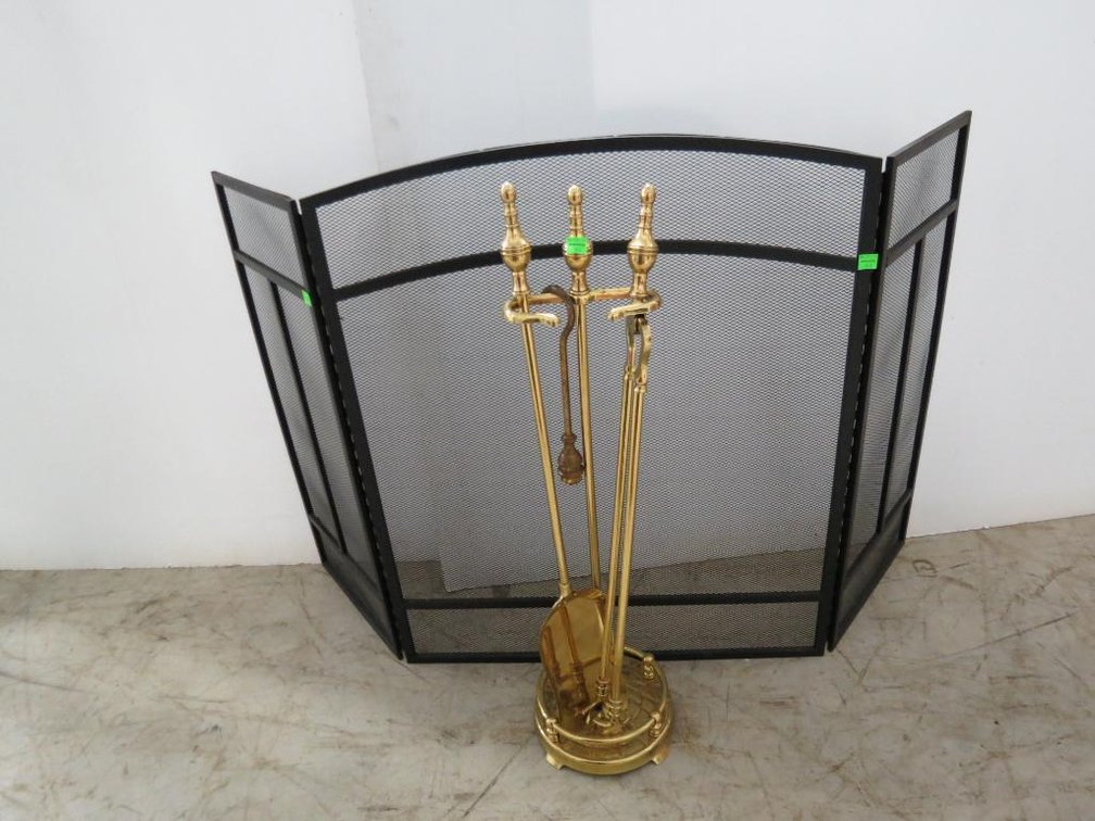 Black fireplace screen and brass fireplace tools