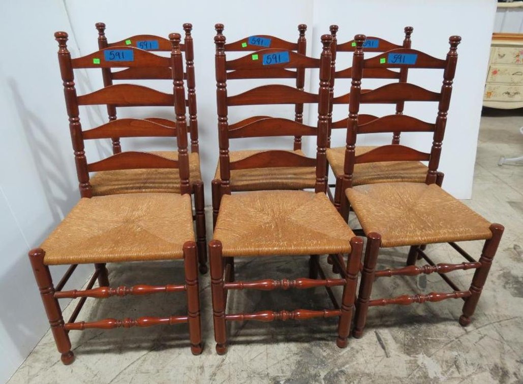 A matched set of six maple(?) ladder-back chairs with rush seats.