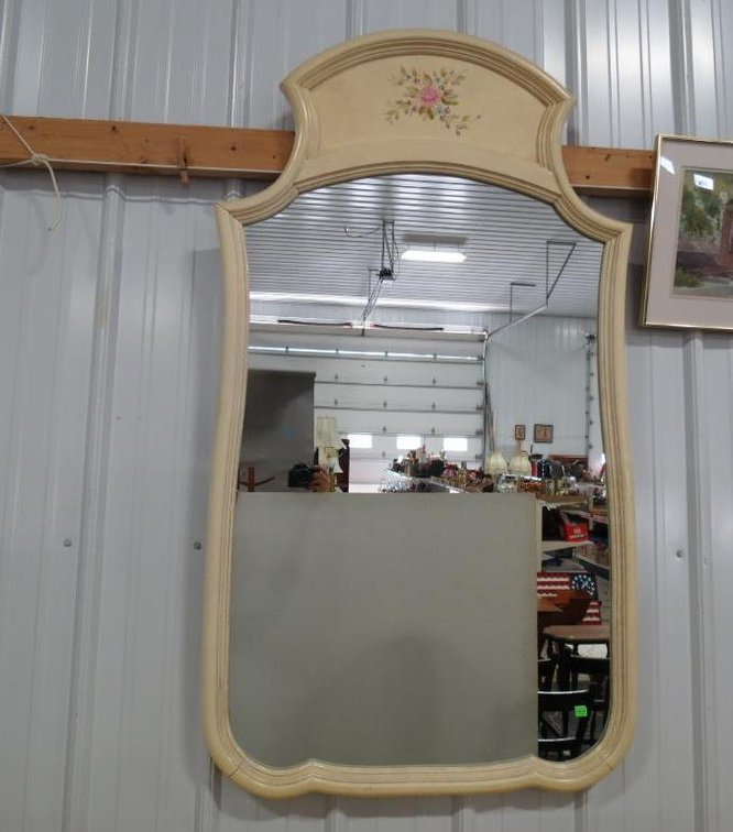 a wall mirror matching the master bedroom suite.