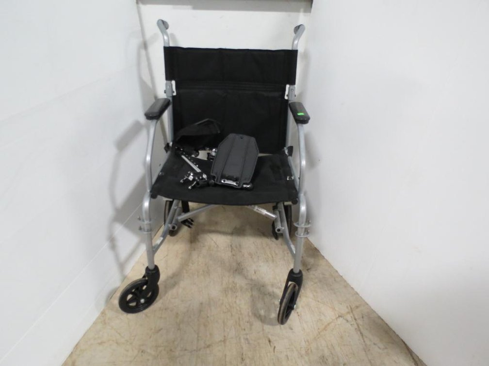A midline transport chair with foot rests.
