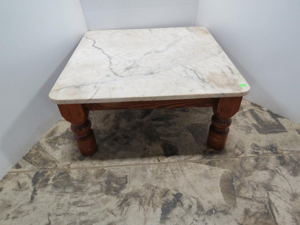 Square coffee table with detached marble top.