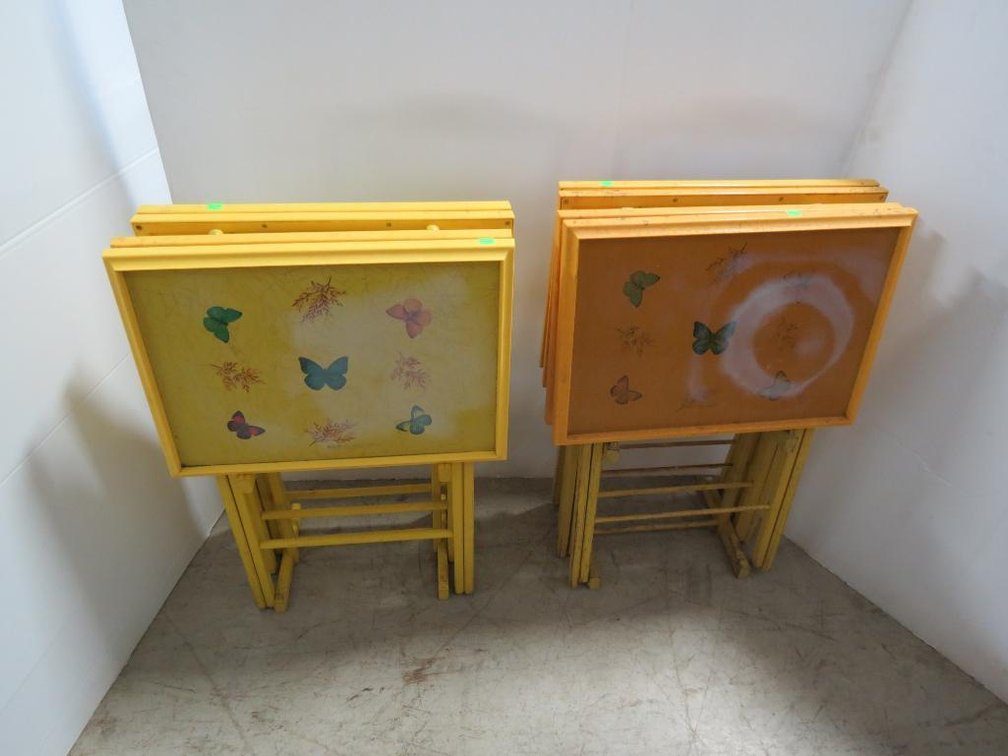 A collection of eight vintage collapsible trays with two carrying stands.