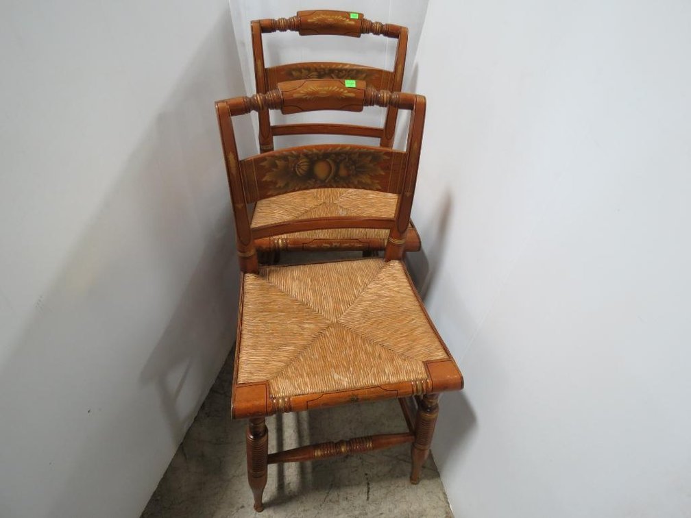 A matching pair of Hitchcock style chairs with rush seats.