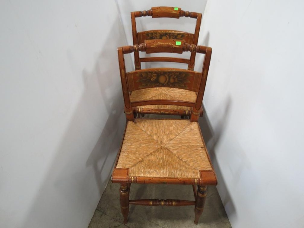 A matching pair of Hitchcock style chairs with rush seats.