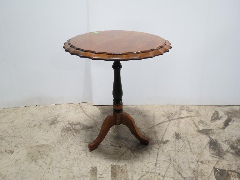 A small tilt top table by Brandt.