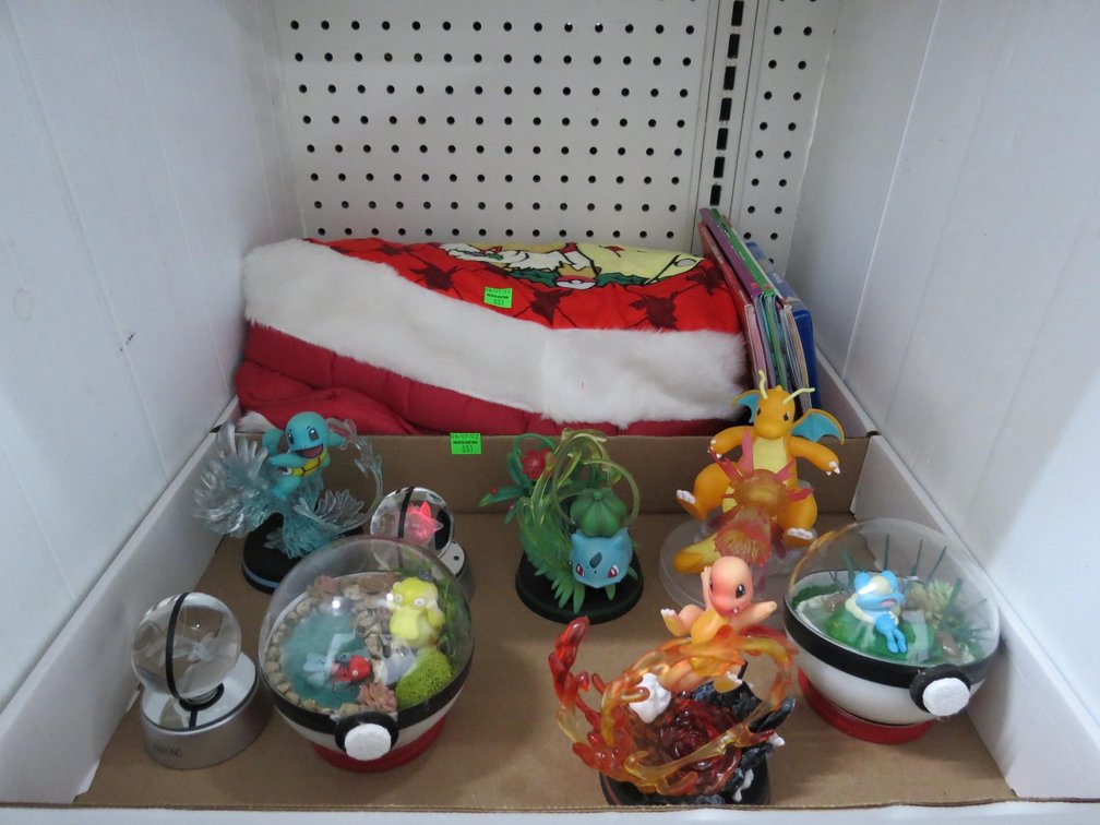 Pokemon Figurines, Pokemon Christmas Tree Skirt and Some Books