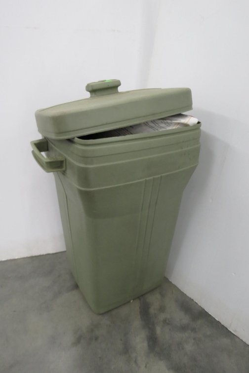 Two Bags of Organic Holly-Tone Fertilizer and Plastic Trash Can