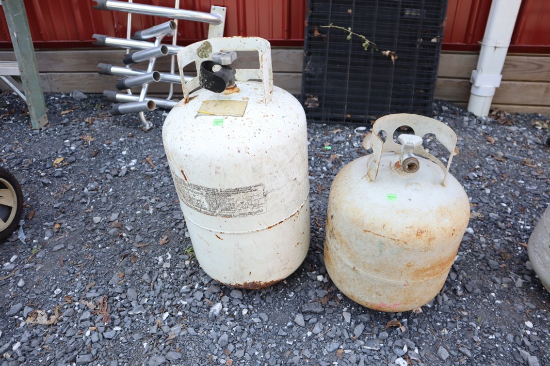 Pair of Propane Tanks, Smaller One Is Approximately Half Full