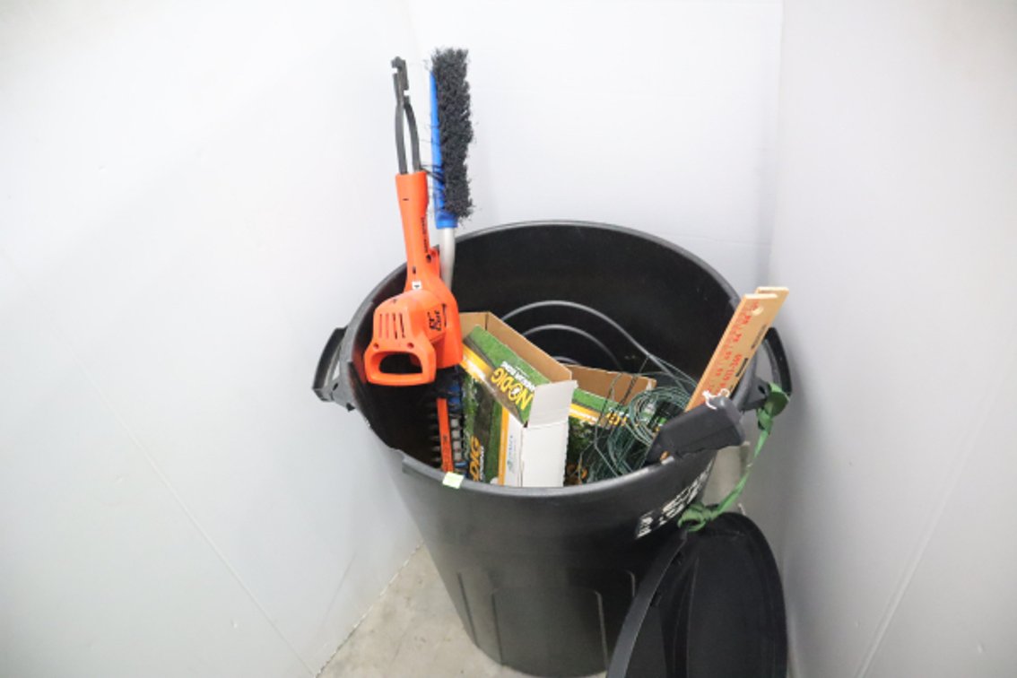 Trash Barrel With Some Landscape Edging, Garden Fence, Electric Hedge Trimmer