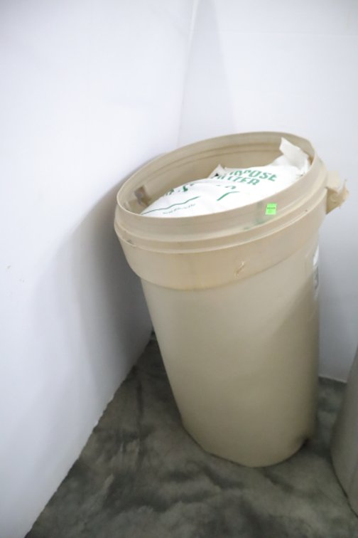 Trash Can With 3 Bags of 10-10-10 Fertilizer and 1 Bag of Urea