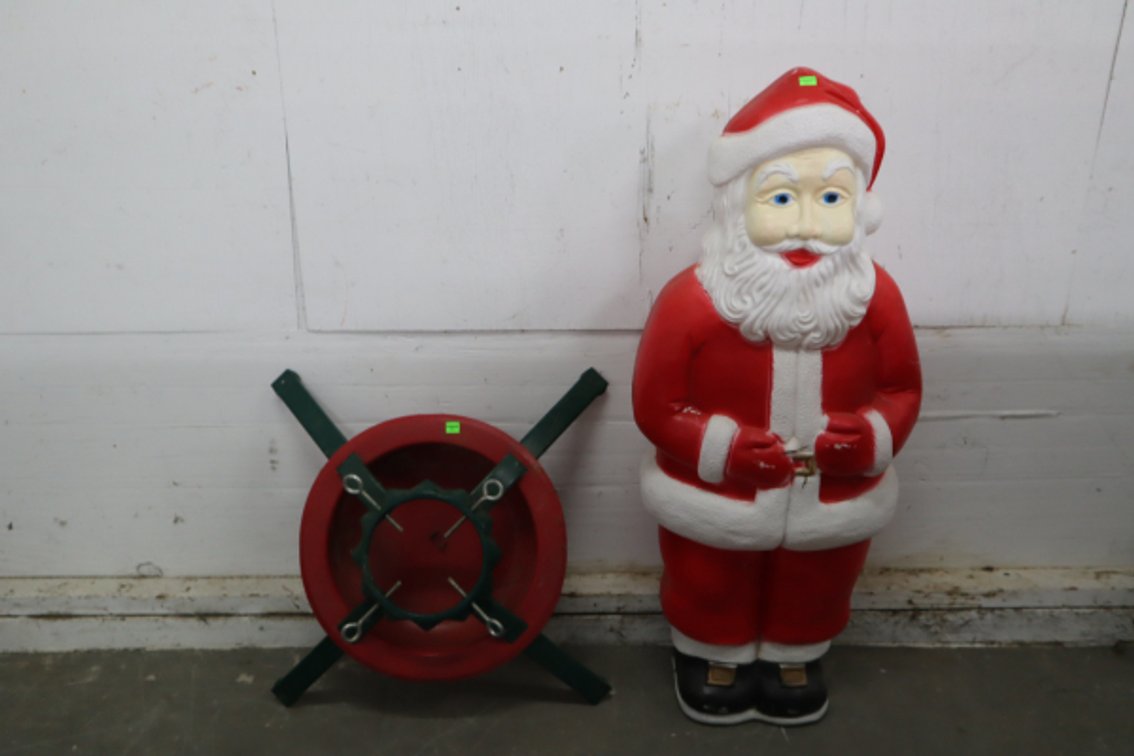 Plastic Santa Lighted Lawn Ornament and A Christmas Tree Stand