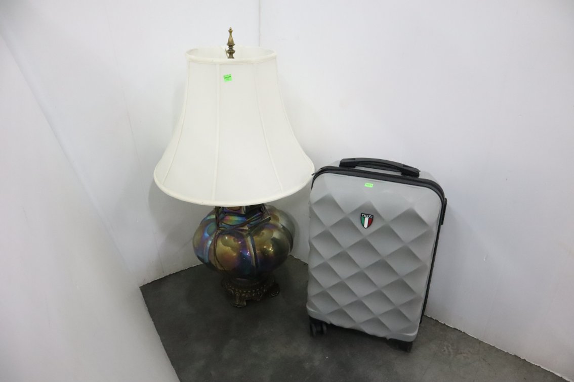 Glass Table Lamp and A Suitcase