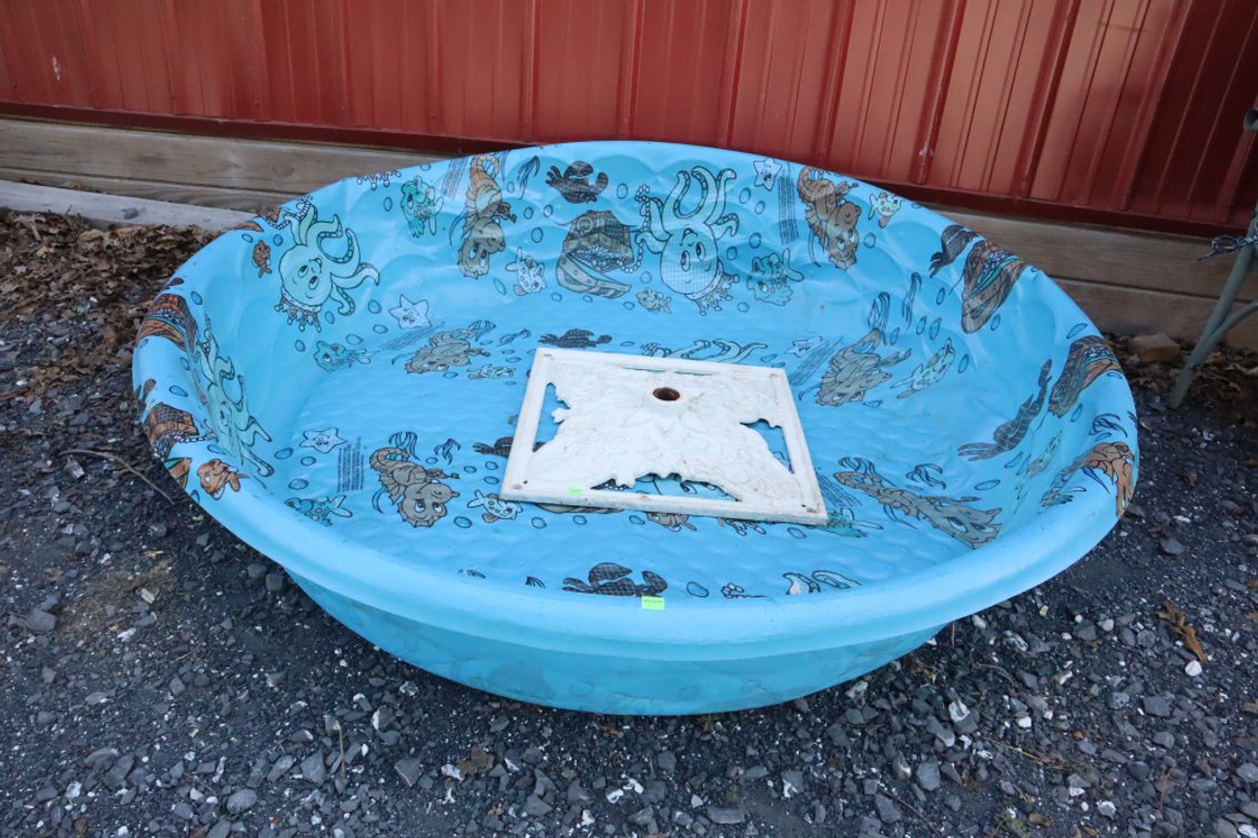 Plastic Pool and Cast Iron Umbrella Stand