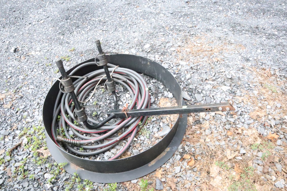 Part of Bicycle Rack, Garden Hose, Fireplace Ring Rim