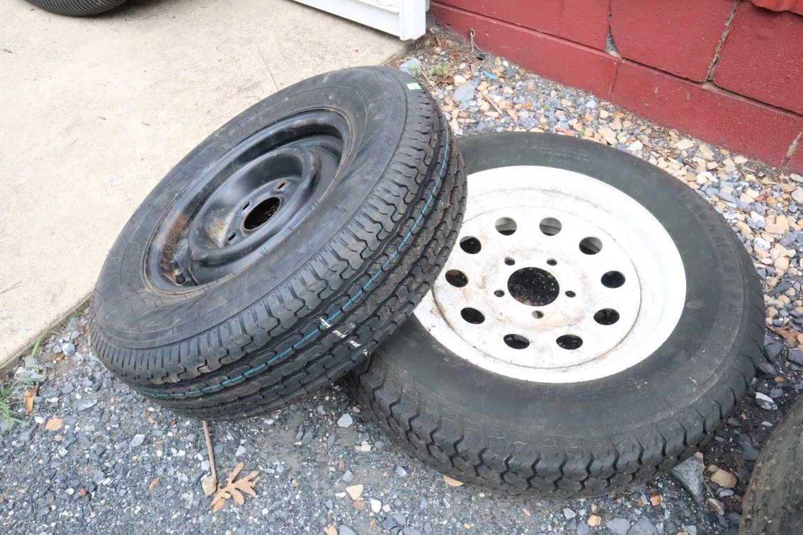 Pair of Spare Wheels, One Is Like New, One Is Well Worn