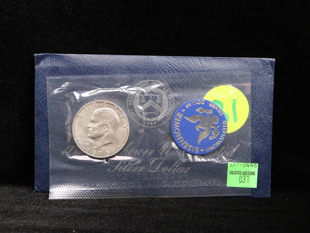1973 Eisenhower Dollar in Blue Envelope. Unc.