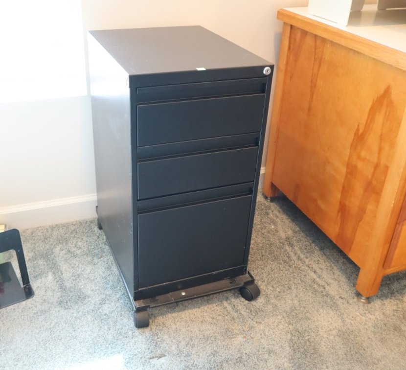 Metal Filing Cabinet Three Drawer Cabinet With Key. Set On Wheeled Base
